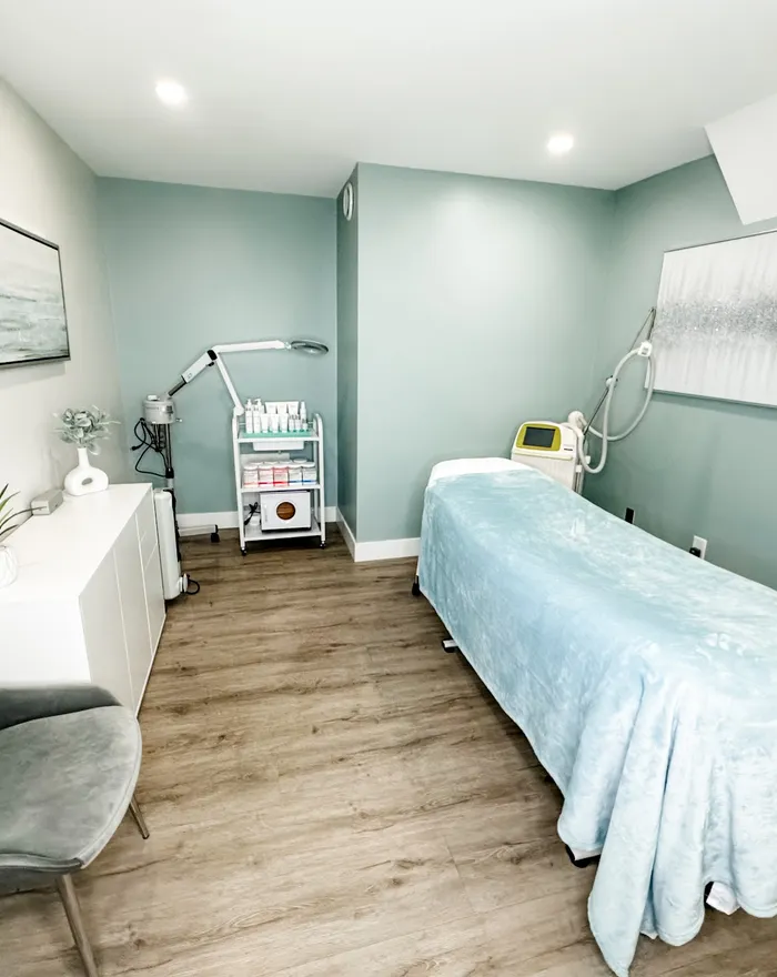 Treatment room with bed and laser